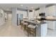 Open kitchen features a large island with bar seating and stainless steel appliances at 410 Winter Bliss Ln, Mount Dora, FL 32757