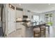 Well-equipped kitchen with a large island, bar stool seating, and stainless steel appliances at 410 Winter Bliss Ln, Mount Dora, FL 32757