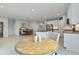 Open floor plan showcasing the kitchen with island, dining area, and tile flooring at 410 Winter Bliss Ln, Mount Dora, FL 32757