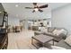 Open-concept living room flowing into a kitchen and dining area, creating an ideal space for entertaining at 410 Winter Bliss Ln, Mount Dora, FL 32757