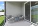 Relaxing screened patio with comfortable seating overlooking the fenced backyard at 410 Winter Bliss Ln, Mount Dora, FL 32757