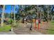 Outdoor playground with a wooden castle structure, providing a fun and engaging play area at 410 Winter Bliss Ln, Mount Dora, FL 32757