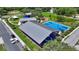 Aerial view of sheltered basketball courts and covered picnic pavilions in a vibrant park setting at 410 Winter Bliss Ln, Mount Dora, FL 32757