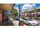 Charming street view featuring local shops, palm trees, parked cars, and awnings at 410 Winter Bliss Ln, Mount Dora, FL 32757