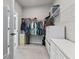 Spacious walk-in closet featuring custom shelving and storage solutions for optimal organization at 410 Winter Bliss Ln, Mount Dora, FL 32757