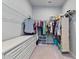 Organized walk-in closet with shelving, drawers, and ample hanging space for clothes and accessories at 410 Winter Bliss Ln, Mount Dora, FL 32757