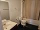 A full bathroom with a sink and vanity, toilet and bathtub with a shower curtain at 438 Janice Kay Pl, Kissimmee, FL 34744