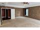 Bedroom with a door, a window, and stained walls at 438 Janice Kay Pl, Kissimmee, FL 34744