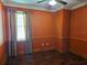 Bedroom with a ceiling fan and window with curtains at 438 Janice Kay Pl, Kissimmee, FL 34744