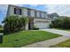 Charming two-story home with a well-manicured lawn and inviting curb appeal at 438 Janice Kay Pl, Kissimmee, FL 34744