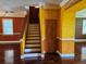 Bright hallway featuring hardwood floors and a staircase at 438 Janice Kay Pl, Kissimmee, FL 34744