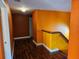 Hallway with hardwood floors and painted walls at 438 Janice Kay Pl, Kissimmee, FL 34744
