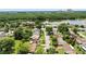 Community aerial view featuring nearby lake and surrounding trees at 4825 Loretta Ln, Orlando, FL 32821