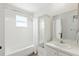Bathroom features shower-tub combo, large mirror, and vanity, providing a functional and well-lit space at 4825 Loretta Ln, Orlando, FL 32821