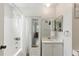 Bathroom features shower-tub combo, large mirror, and vanity, providing a functional and well-lit space at 4825 Loretta Ln, Orlando, FL 32821