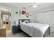 Inviting bedroom features neutral decor, ceiling fan, and closet, offering a serene retreat for relaxation at 4825 Loretta Ln, Orlando, FL 32821