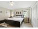 Comfortable bedroom boasts natural light, ceiling fan, and closet, providing a relaxing and functional space at 4825 Loretta Ln, Orlando, FL 32821