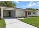 A well-maintained single-Gathering home with a neat lawn and a convenient carport at 4825 Loretta Ln, Orlando, FL 32821