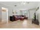 Spacious living room featuring neutral paint, tile floors, and an open layout at 4825 Loretta Ln, Orlando, FL 32821