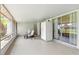 Covered screened porch area featuring a refrigerator and seating at 4825 Loretta Ln, Orlando, FL 32821