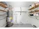 Neat utility room featuring a water heater and shelving for storage solutions at 4825 Loretta Ln, Orlando, FL 32821