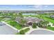 Overhead view of community clubhouse, pool, playground, and lake at 5030 Caspian St, St Cloud, FL 34771