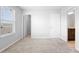 Spacious bedroom with natural light, carpet flooring, walk-in closet, and attached bathroom at 5030 Caspian St, St Cloud, FL 34771