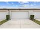 Attached garages with individual doors and well-maintained landscaping at 5030 Caspian St, St Cloud, FL 34771