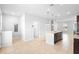 A neutral living space with tile floors, recessed lighting and views to the exterior through large windows at 5030 Caspian St, St Cloud, FL 34771