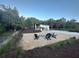 Outdoor gathering area with a fire pit and Adirondack chairs at 610 Cypress Ave, Orange City, FL 32763