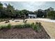 Backyard with a fire pit and Adirondack chairs at 610 Cypress Ave, Orange City, FL 32763