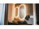 Chic bathroom showcasing dual lighted mirrors, creating a bright and modern aesthetic at 610 Cypress Ave, Orange City, FL 32763