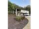 Modern two-story house with white brick, black trim and tasteful landscaping at 610 Cypress Ave, Orange City, FL 32763