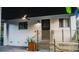 An exterior of the home shows a modern accent wall and a black door at 610 Cypress Ave, Orange City, FL 32763