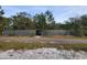 Property with new long, gray fence providing privacy and a sense of security at 610 Cypress Ave, Orange City, FL 32763