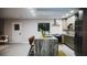 Modern kitchen with waterfall countertops, island seating, contemporary fixtures, and stainless steel appliances at 610 Cypress Ave, Orange City, FL 32763