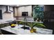 Modern kitchen featuring granite countertops, a large island, and stainless steel appliances at 610 Cypress Ave, Orange City, FL 32763
