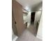 A kitchenette features marbled countertops, custom cabinetry and views into an attached bathroom at 610 Cypress Ave, Orange City, FL 32763