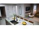 Living space featuring a decorative island, an open floor plan, comfortable seating, and a mounted television at 610 Cypress Ave, Orange City, FL 32763