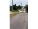 Asphalt road and bridge with lush trees, providing a scenic transportation route and natural backdrop at 610 Cypress Ave, Orange City, FL 32763