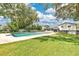 A well-maintained backyard with a large, refreshing pool and ample green space for outdoor activities at 614 Mockingbird Ln, Altamonte Springs, FL 32714