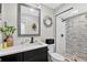 Updated bathroom offers sleek black fixtures, decorative mirrors, and a glass shower at 614 Mockingbird Ln, Altamonte Springs, FL 32714