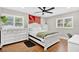 Bedroom boasts wood floors, ceiling fan, bright windows, and lots of dresser space at 614 Mockingbird Ln, Altamonte Springs, FL 32714