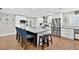 Bright kitchen with white cabinets, granite countertops, stainless steel appliances, and island with seating at 614 Mockingbird Ln, Altamonte Springs, FL 32714