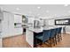 Bright kitchen with white cabinets, granite countertops, stainless steel appliances, and island with seating at 614 Mockingbird Ln, Altamonte Springs, FL 32714