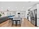 Bright kitchen with white cabinets, granite countertops, stainless steel appliances, and island with seating at 614 Mockingbird Ln, Altamonte Springs, FL 32714