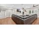 Spacious living room with hardwood floors, a large gray couch, and sliding glass doors to the backyard at 614 Mockingbird Ln, Altamonte Springs, FL 32714