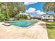 A private pool surrounded by a concrete deck and lush green yard is perfect for relaxation and entertainment at 614 Mockingbird Ln, Altamonte Springs, FL 32714