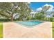 Backyard featuring a pool with concrete patio and trees at 614 Mockingbird Ln, Altamonte Springs, FL 32714