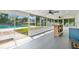 Sunroom with tile flooring and access to the pool area at 614 Mockingbird Ln, Altamonte Springs, FL 32714